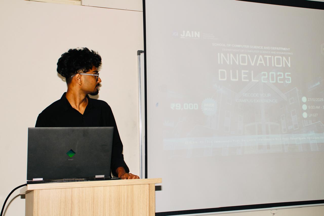 Krishal Karna presenting at Innovation Duel 2025 event — Enigma Club, Jain University